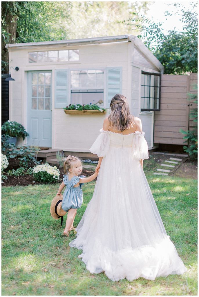 Mother And Daughter Walk Together During Their Motherhood Session In Washington Dc