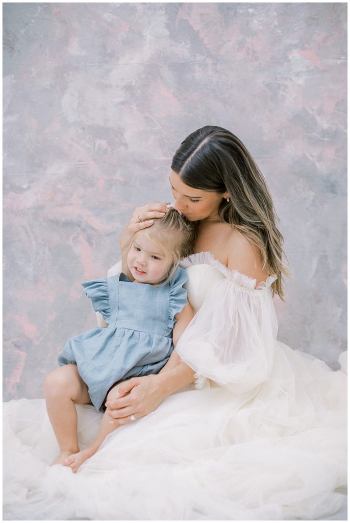 Pregnant Mother Kisses Her Daughters Head During Their Dc Maternity Session