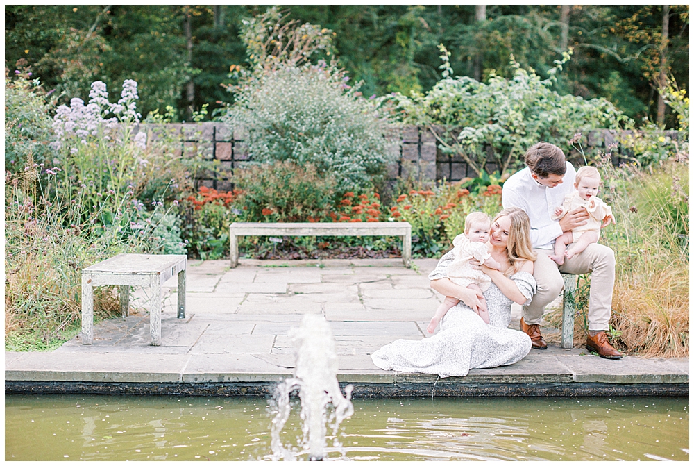 Family Sits By A Pond