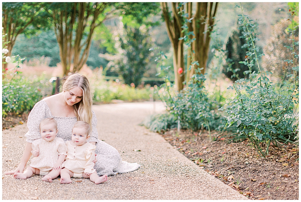 Mother Sits With Her Twin Baby Girls 