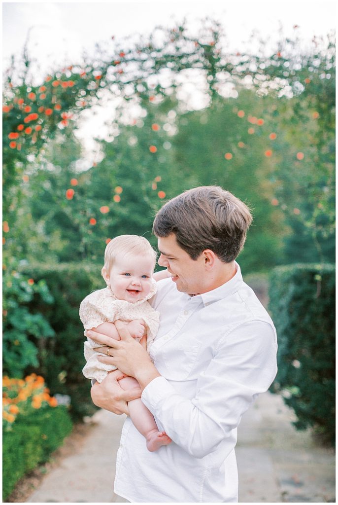 Father Holding His Young Baby Girl In Brookside Gardens