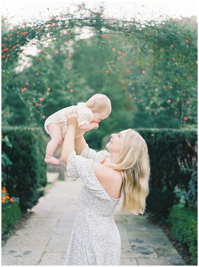 Mother Holds Up Baby