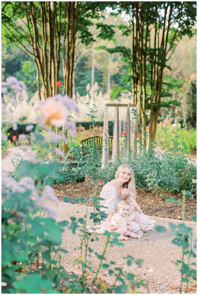 Mother Sitting With Her Baby In Brookside Gardens