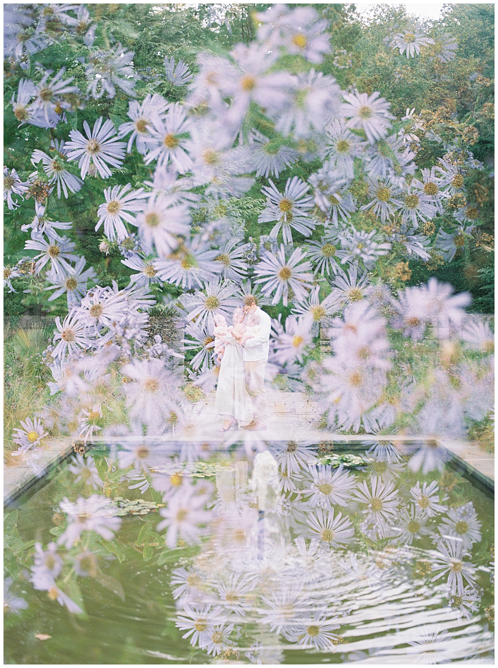 A Double Exposure Of A Family In A Garden With Purple Flowers