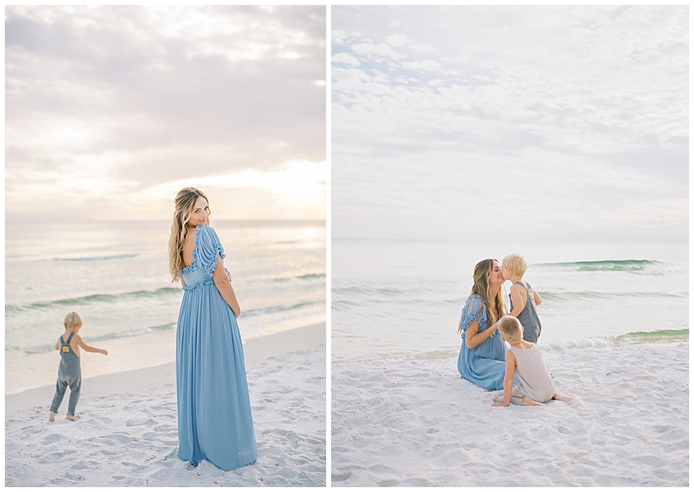 Mother Looks Over Her Shoulder While Standing On The Beach With Her Young Boys During Her Maternity Session