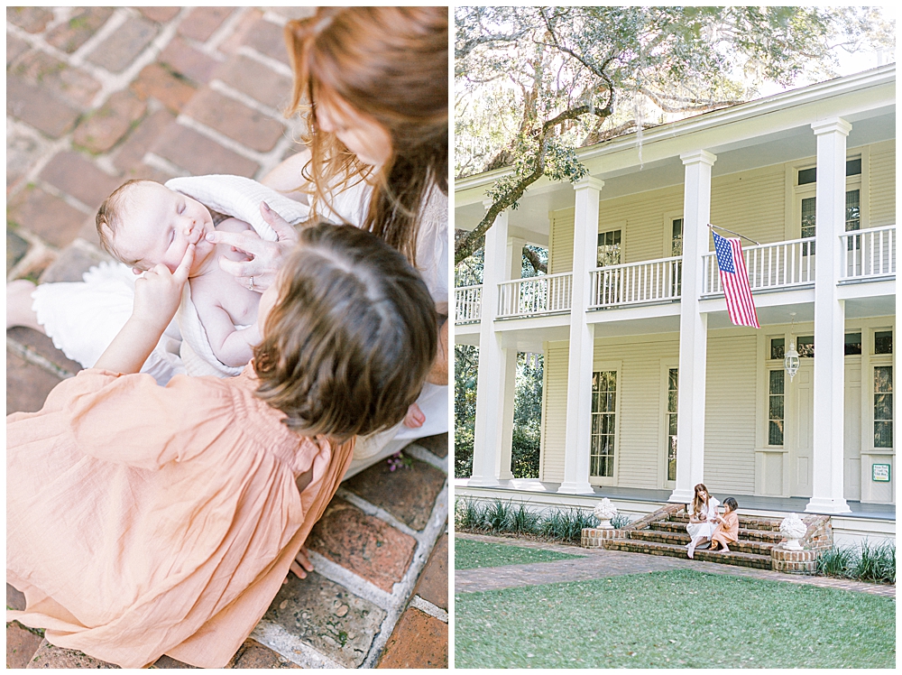 A Little Girl In A Pink Dress Sits With Her Mother On Brick Steps Leading Up To A Large Manor And Caresses Her Mother's New Baby