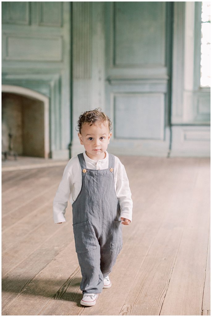 Toddler Boy In Overalls Walks In Salubria Manor