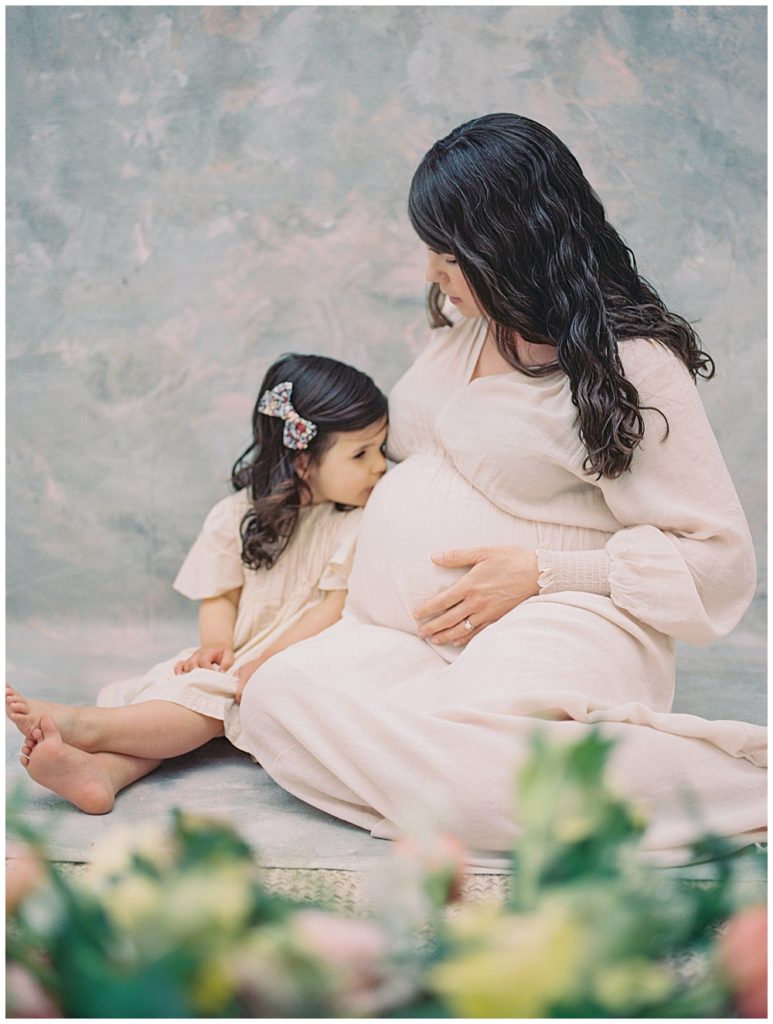 Little Girl Kisses Her Mother's Pregnant Belly 