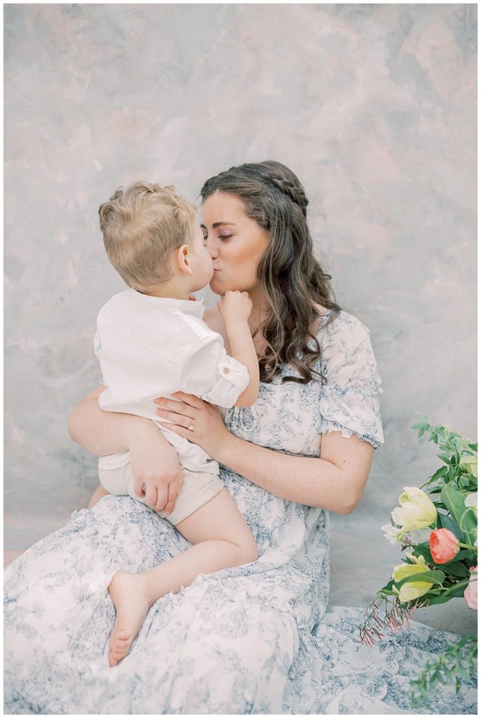 A Mama Kisses Her Little Boy During Her Motherhood Session With Toddler In Dc