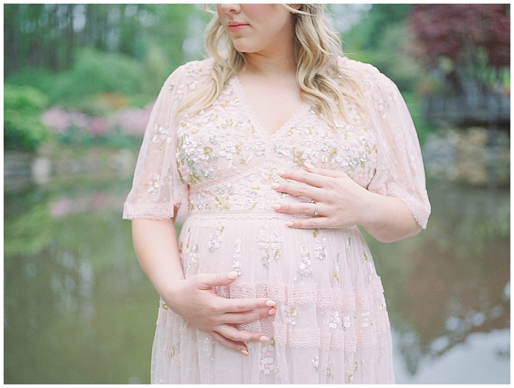 Pregnant Mother Wears A Pink Needle &Amp; Thread Gown With Sequins In Front Of A Pond At Brookside Gardens.