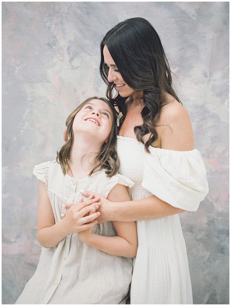 Mother And Daughter Stand Together, Embracing