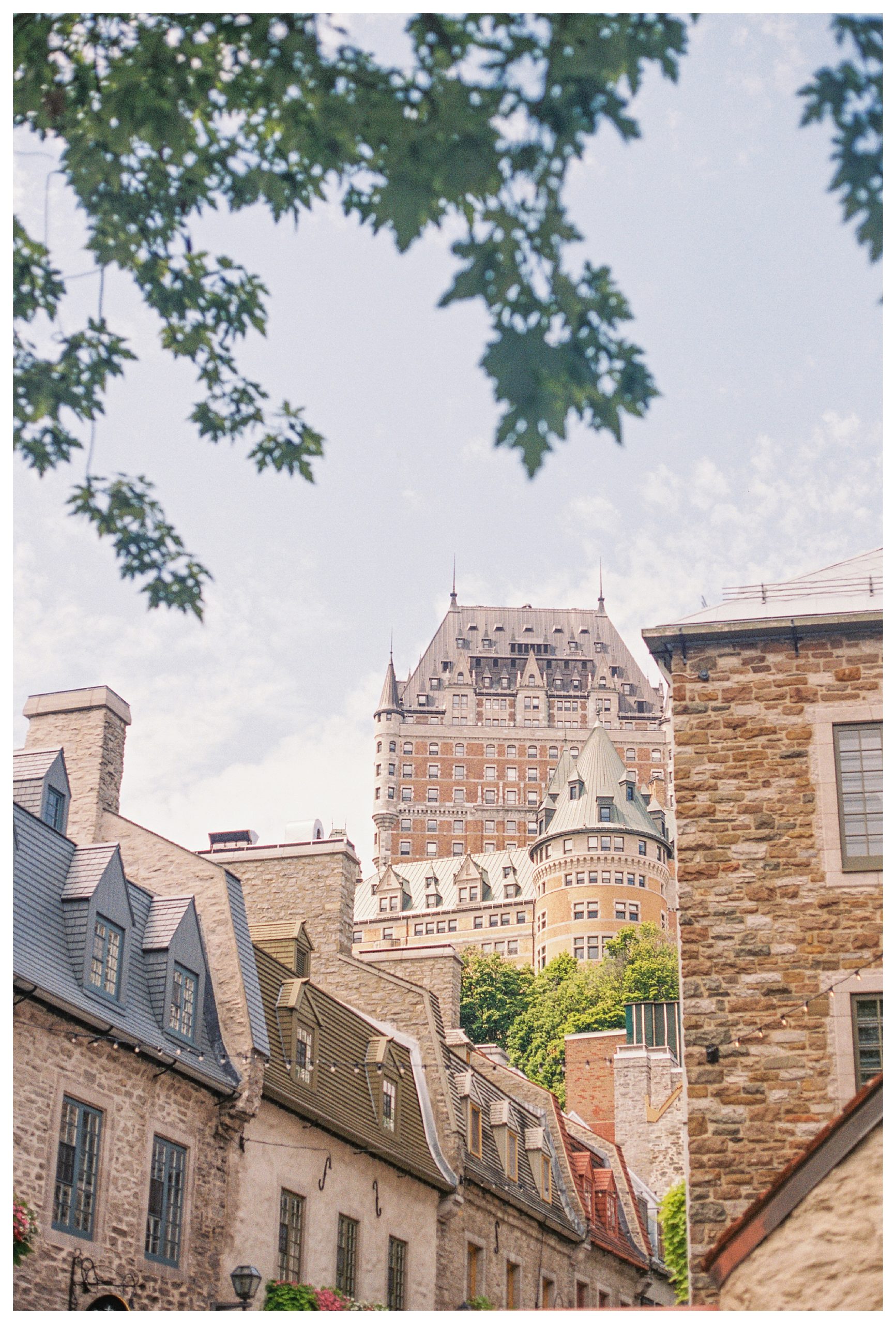 View Of Stone Buildings And The Fairmont Chateau In Quebec City.