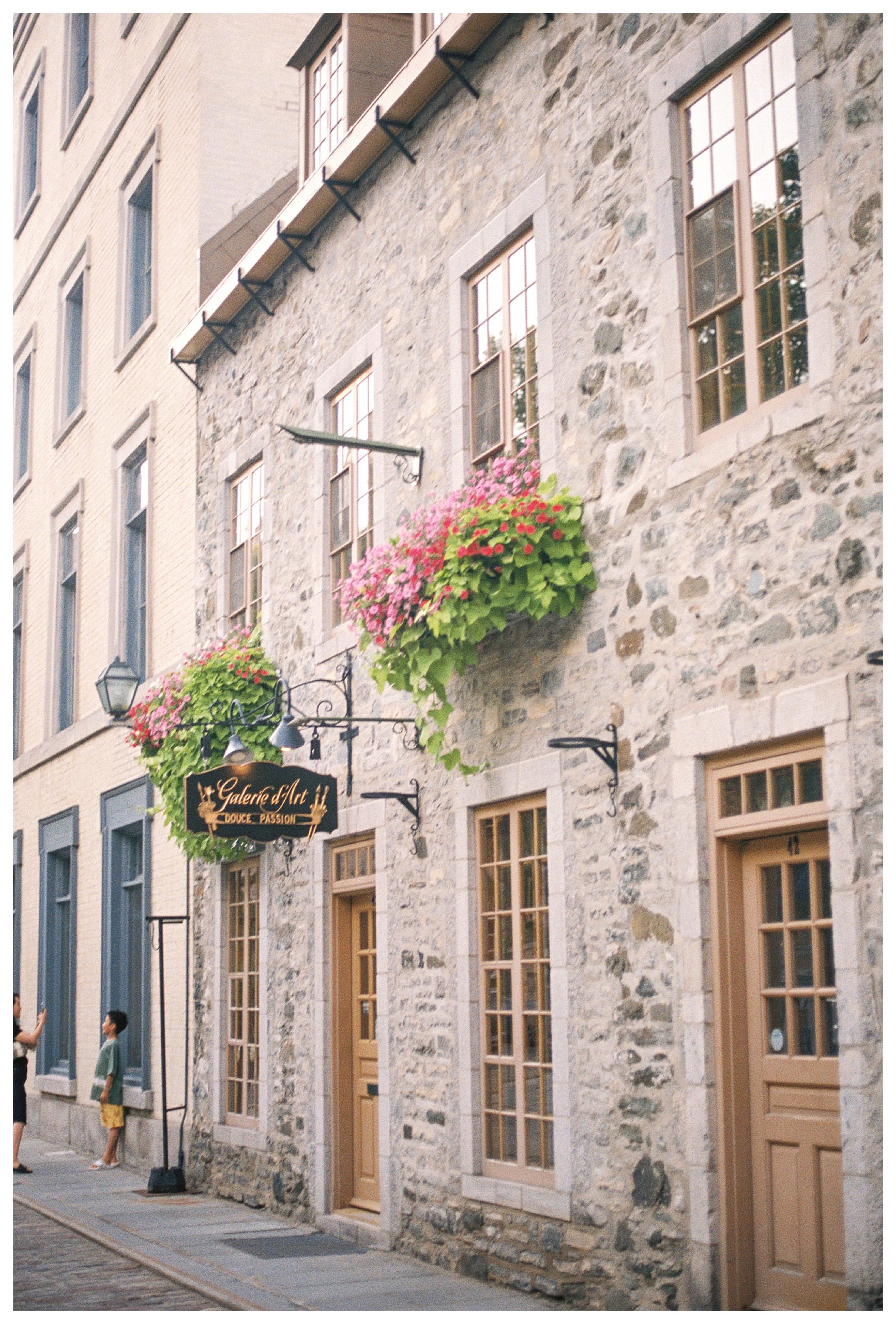 Exterior Of A Stone Building Store Front In Quebec City.