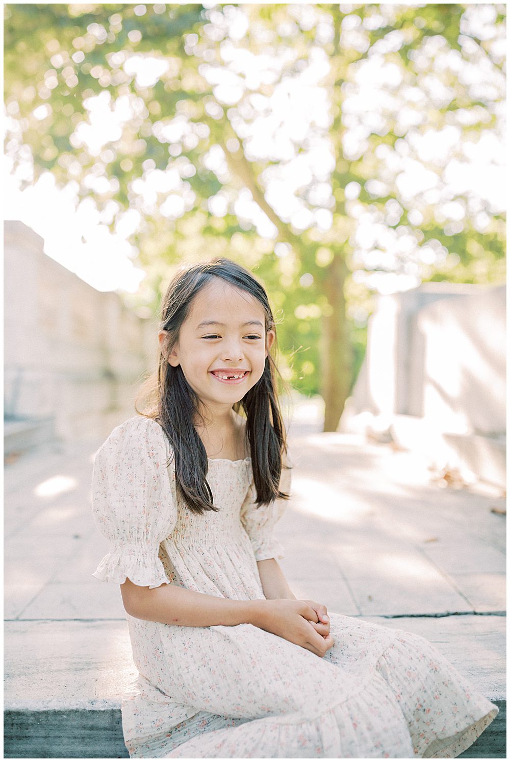 Five Year Old Girl Sits On Steps At Dar Constitution Hall And Smiles During Her Dar Constitution Hall Family Photo Session.