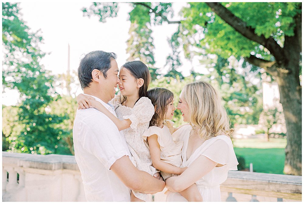 Family Of Four Smile At One Another During Their Photo Session At Dar Constitution Hall.