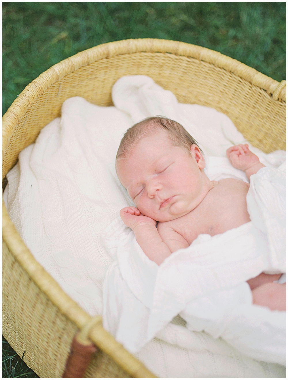 Newborn In A Moses Basket During An Outdoor Studio Newborn Session