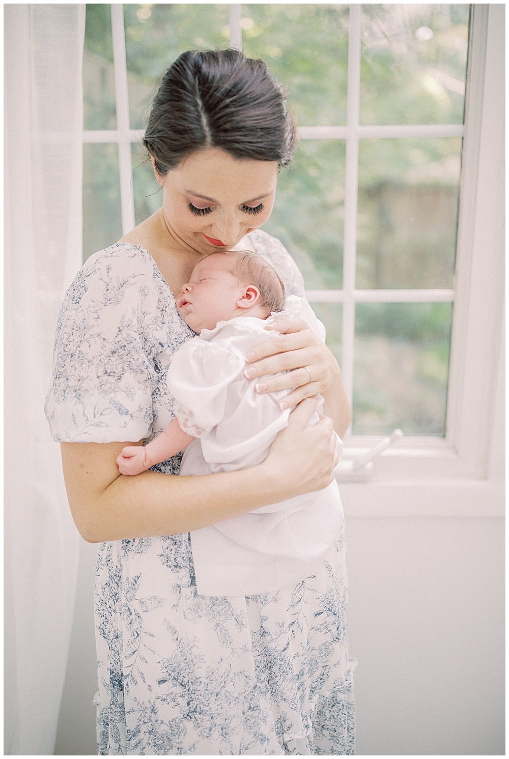 Mom Holds Her Newborn Daughter Against Her Chest