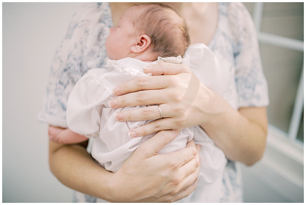 Baby Held To Mother's Chest.