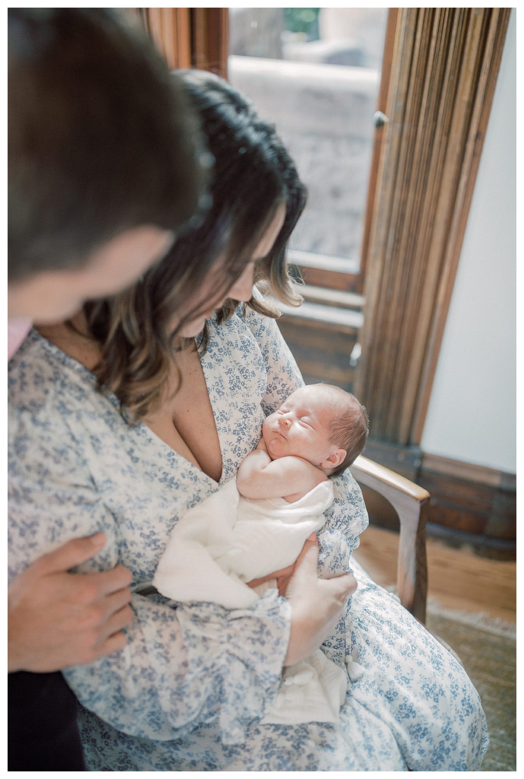 Baby Girl Sleeps In Her Mother's Arms During In-Home Newborn Session In Washington, Dc.