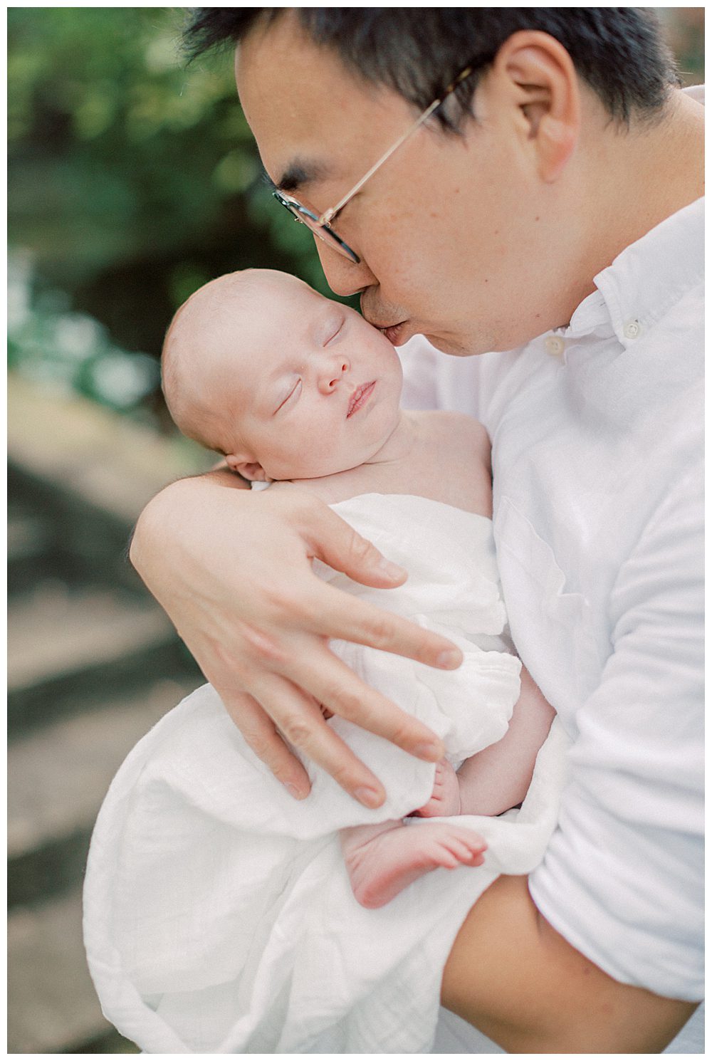 Father Leans Down And Kisses The Cheek Of His Daughter.