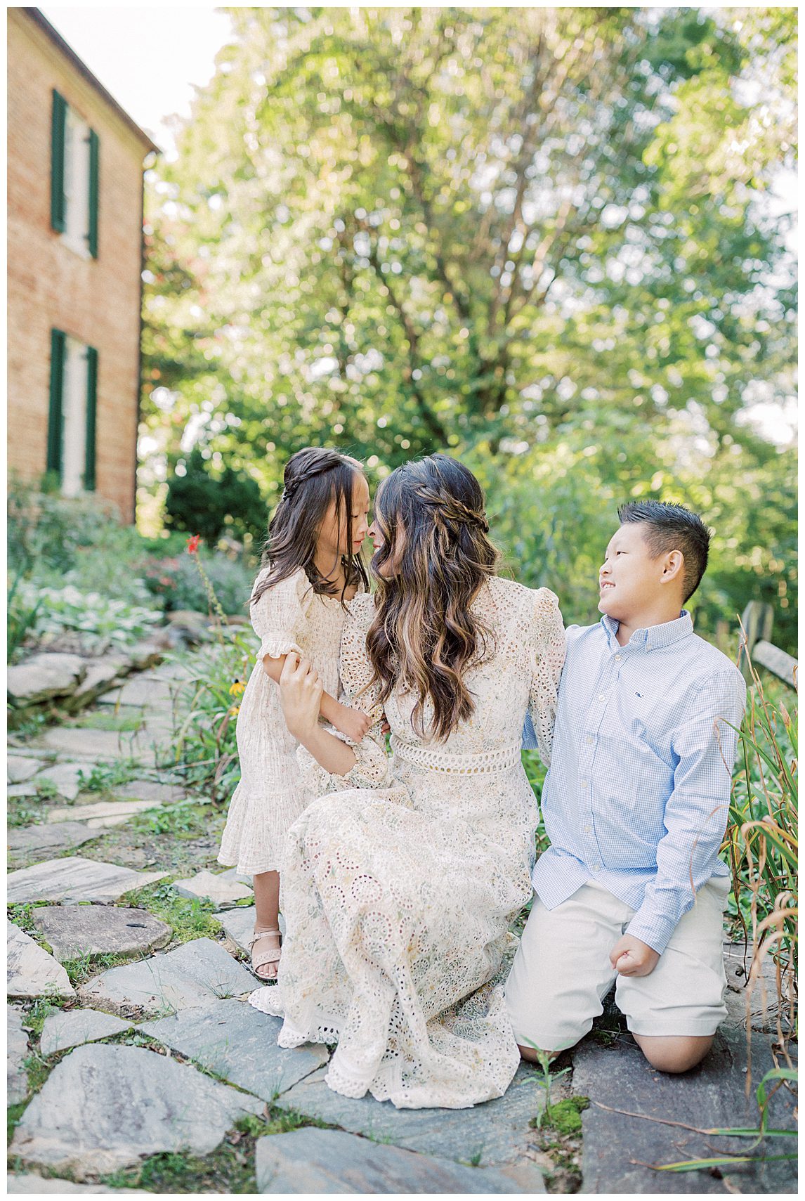 Mother Kneels With Her Two Children During Her Colvin Run Mill Family Photos.