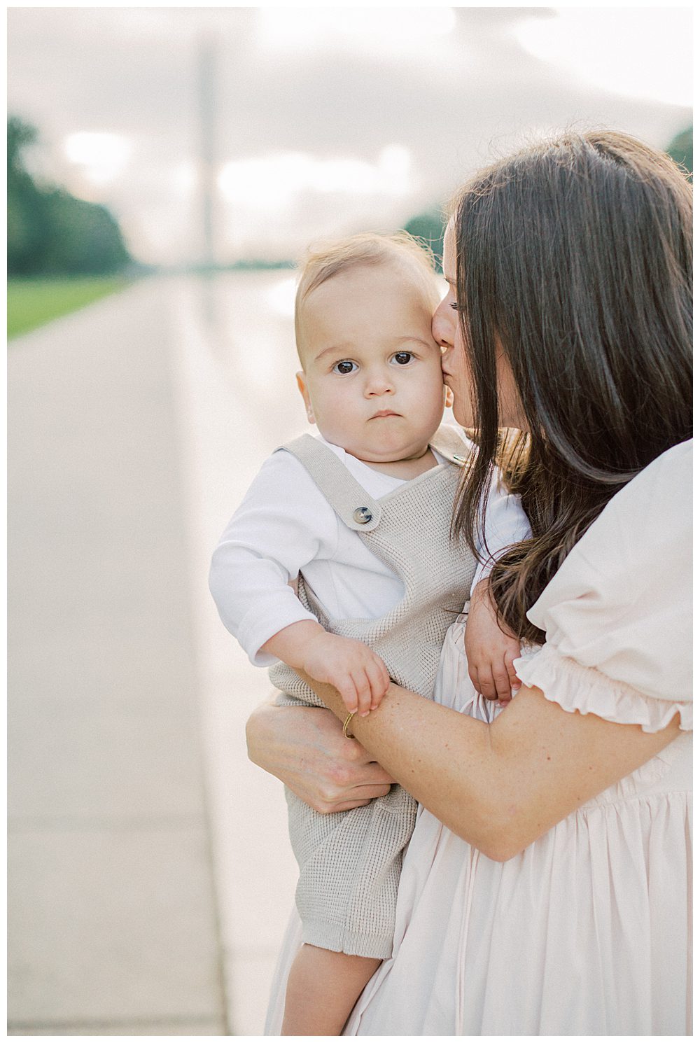 Mother Kisses Toddler's Cheek During Dc Monuments Family Photo Session.