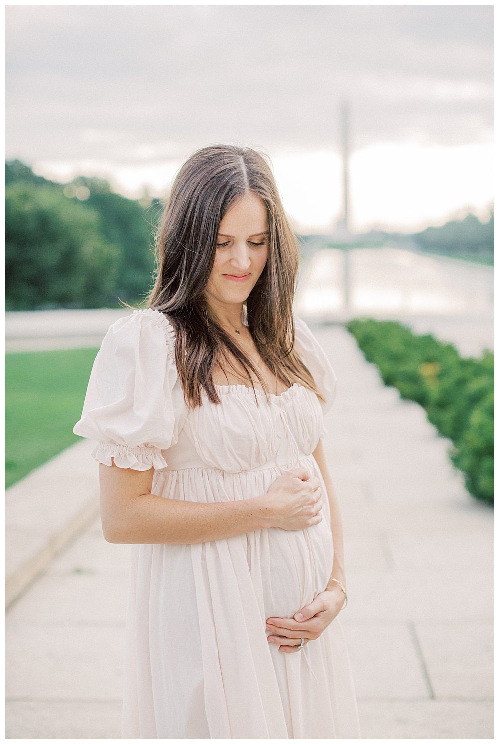 Mother Stands In Front Of The Washington Monument During Dc Monuments Family Photo Session.