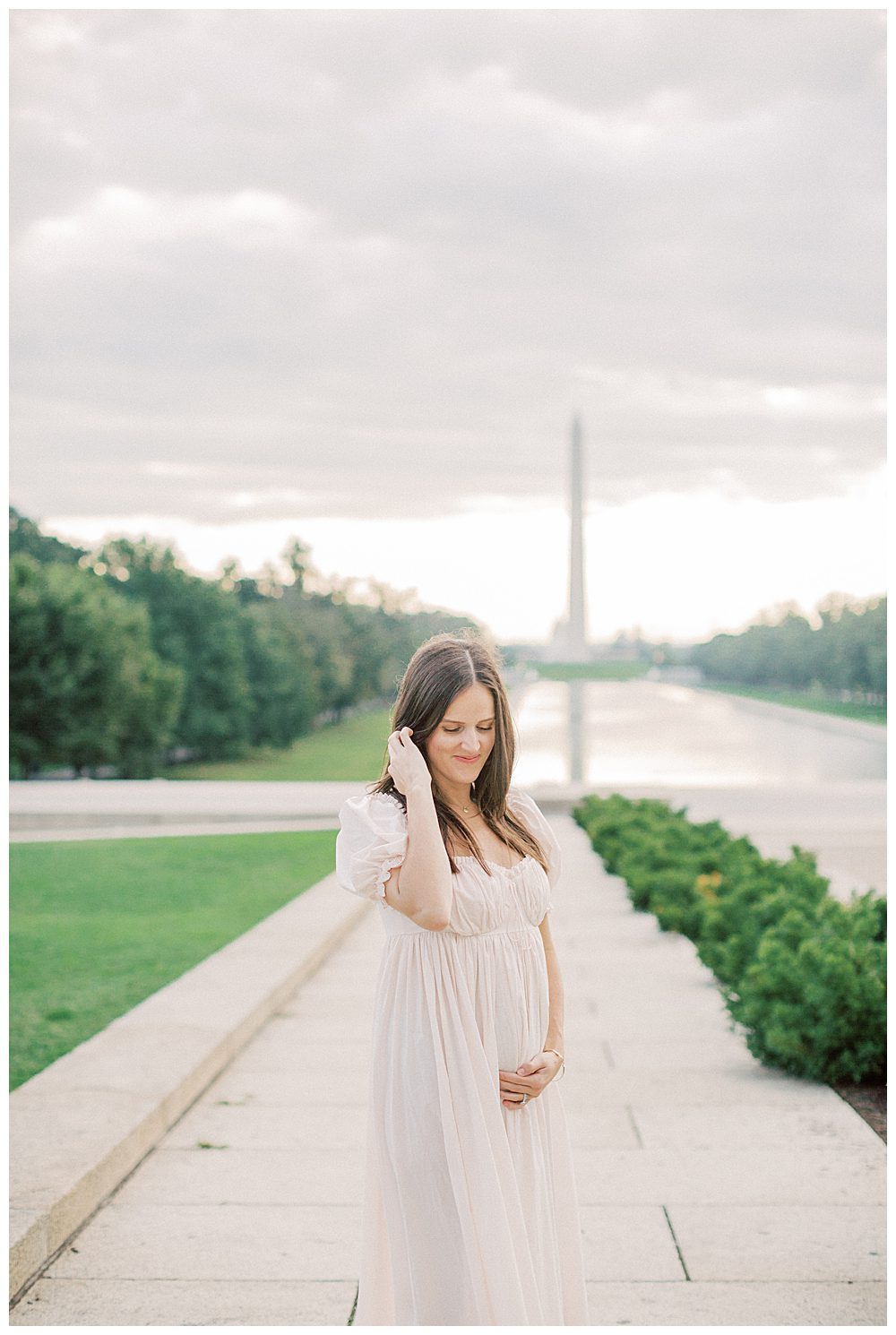 Pregnant Mother Holds Belly During Dc Family Photo Session At Memorials.