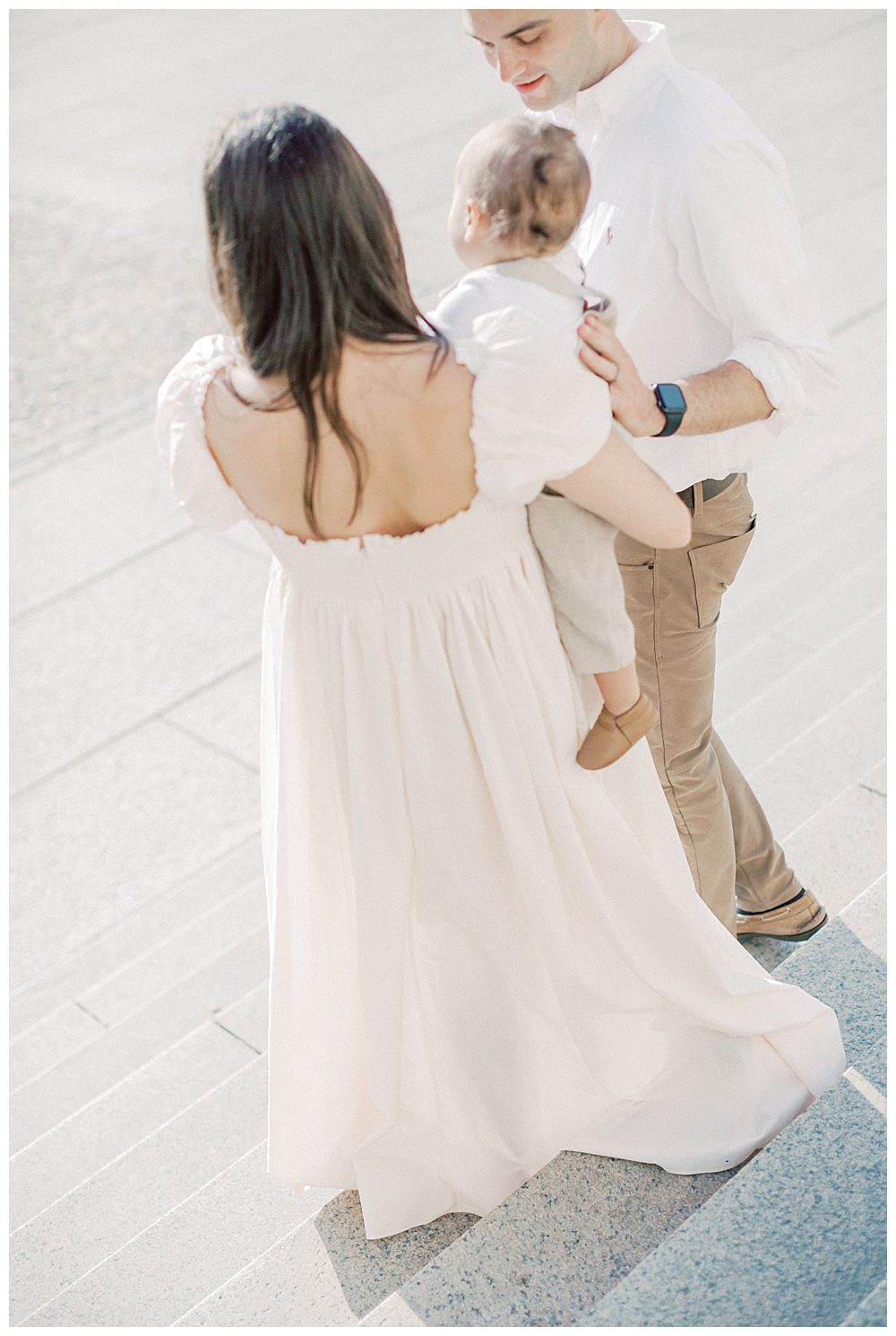 Mother, Father, And Toddler Son Walk Down Steps Of Lincoln Memorial In Dc.