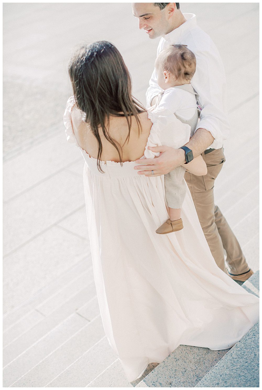 Parents Walk Down Steps Of Lincoln Memorial During Dc Family Photo Session.