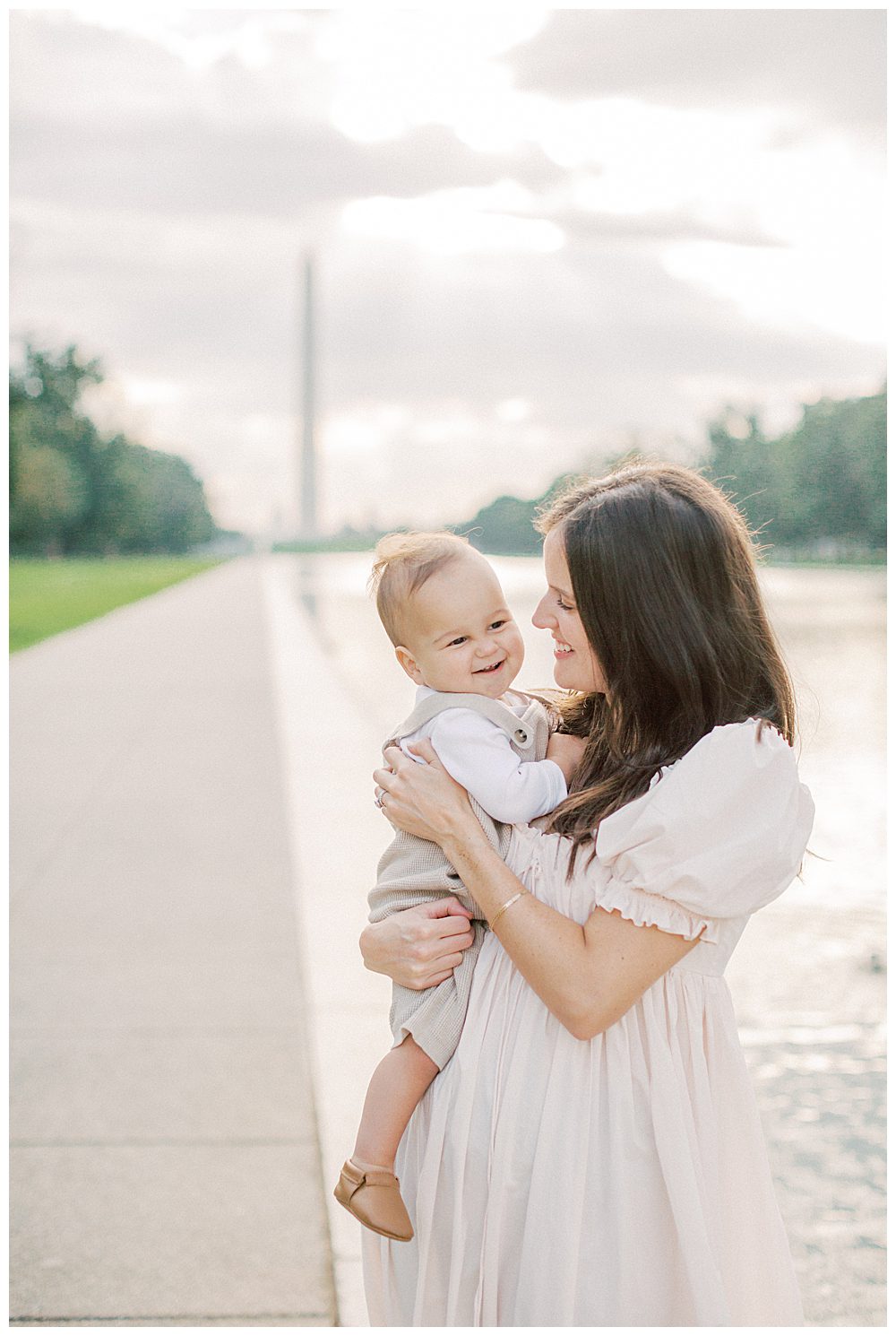 Mother And Son Smile And Play During Dc Monuments Family Photo Session.