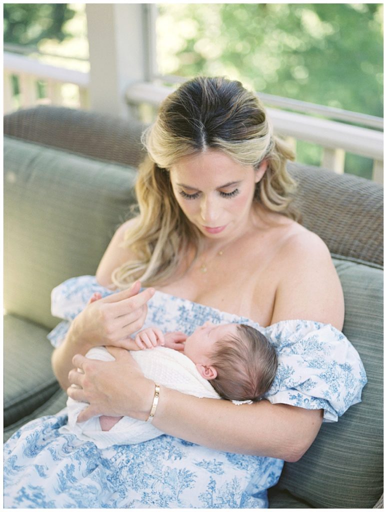 Newborn Baby Girl Wraps Fingers Around Mother's Fingers.