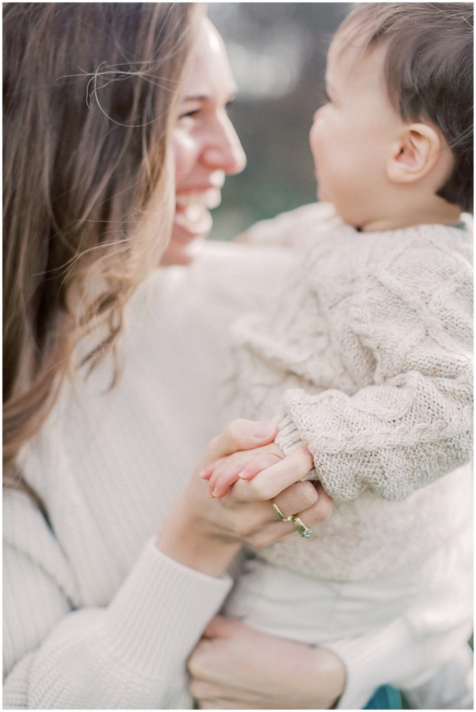 Mother Holds Toddler Son's Hand.