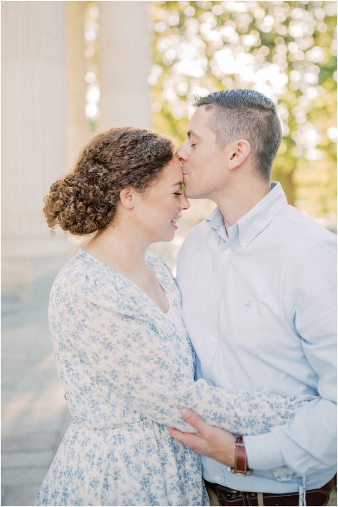 Close-Up Of Father Kissing Mother On The Forehead During Dar Constitution Hall Photos For Family Session.