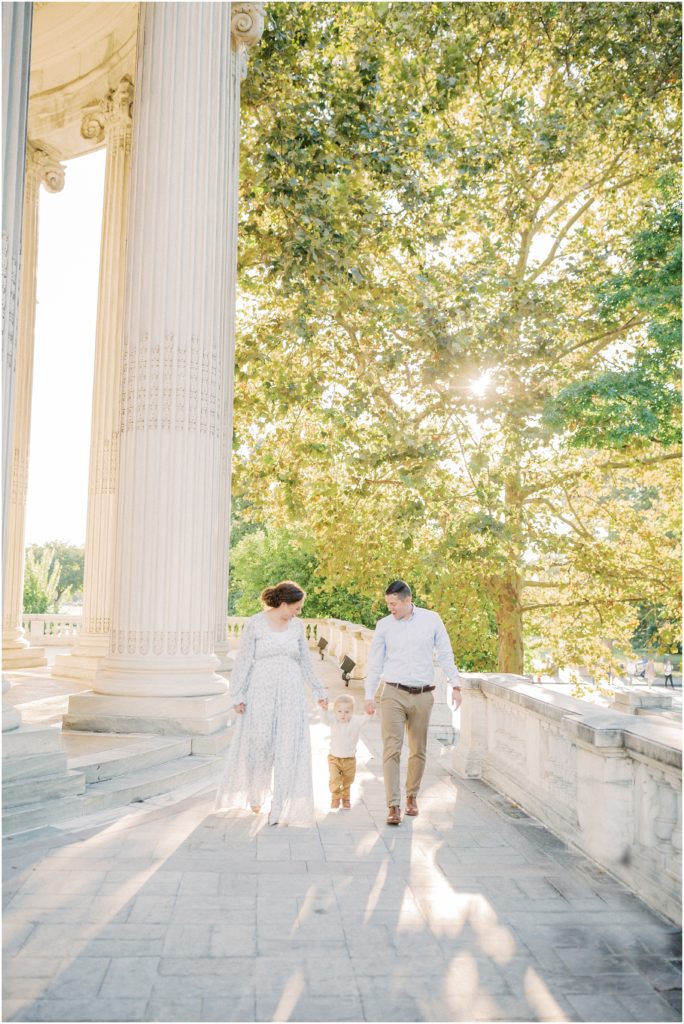 Mother And Father Walk With Their Toddler During Dar Constitution Hall Photos For Family Session.