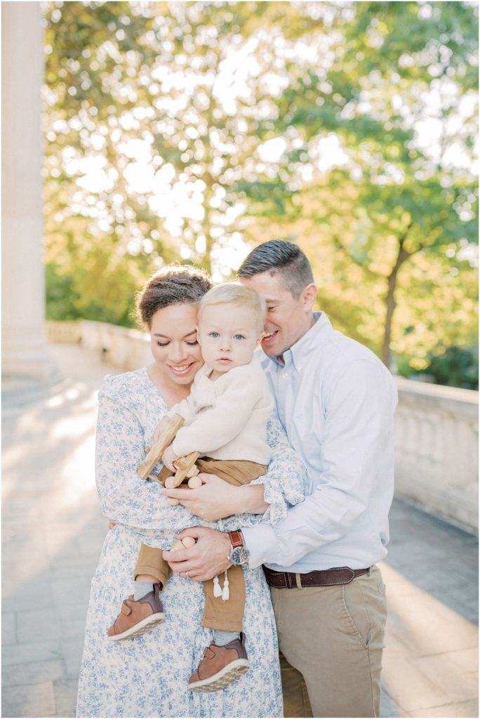 Mother And Father Lean Into Blonde Toddler During Dar Constitution Hall Photos For Family Session.