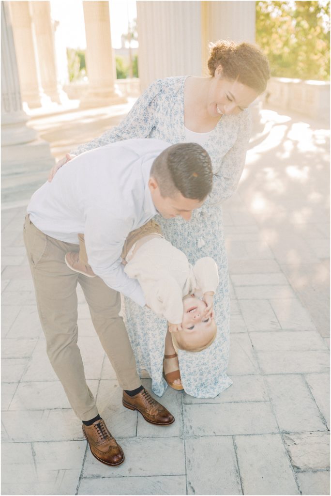 Little Boy Is Hung Upside Down By Father During Dar Constitution Hall Photos For Family Session.