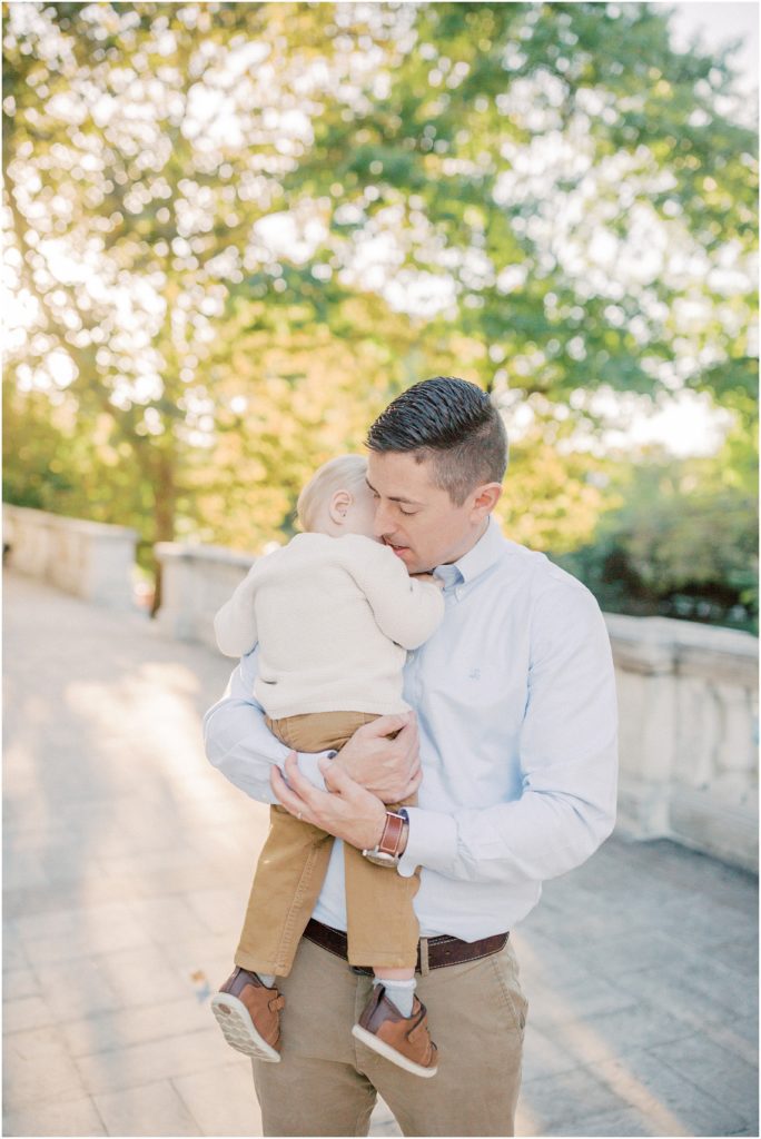 Little Boy Leans Into Father.