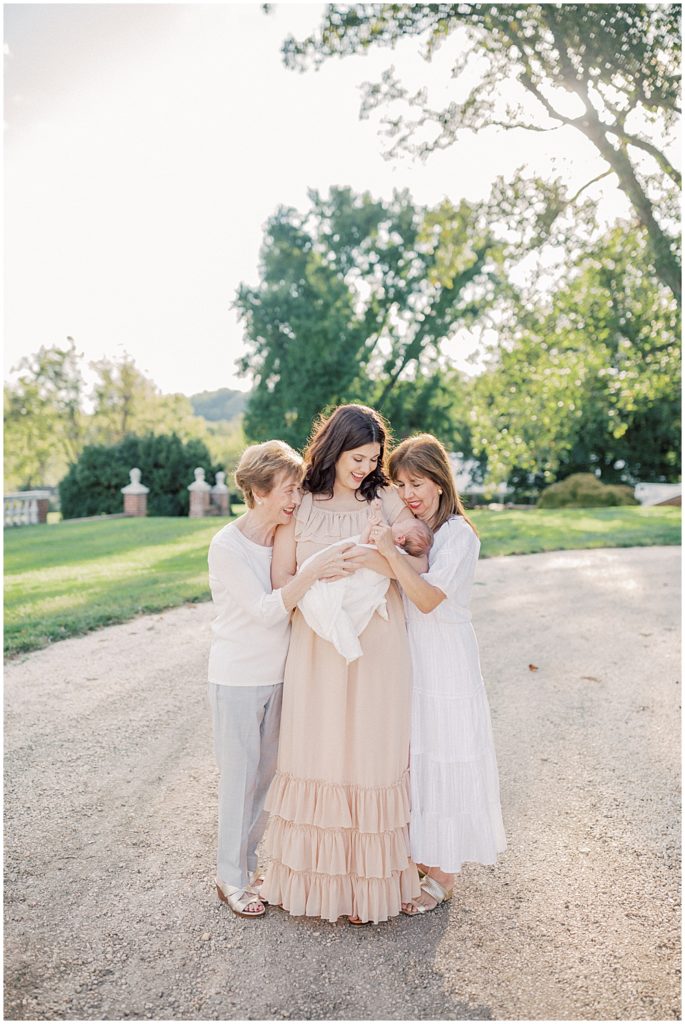 Mother Holds Her Newborn Son While Standing With Her Mother And Grandmother During Newborn Session By Loudoun County Newborn Photographer Marie Elizabeth Photography.