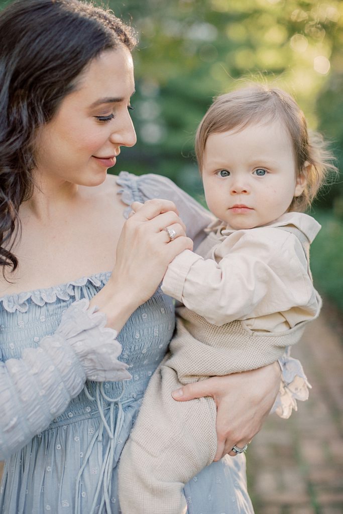 Mother Holds Her Baby's Hand During Family Photos At Tudor Place In Dc.