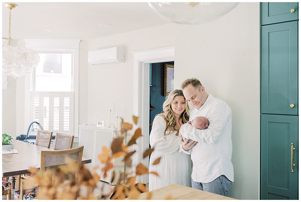 Parents Stand With Their Newborn Baby In Their Kitchen In Washington Dc.