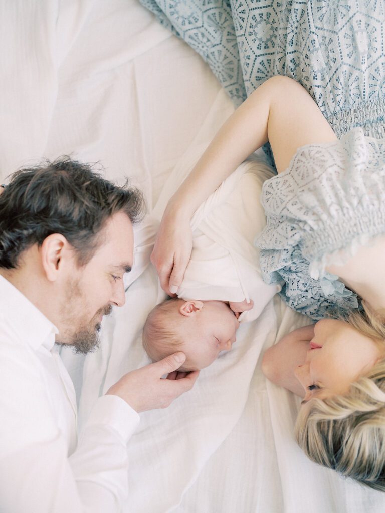 Father, Mother, And Baby Lay Down During Their Silver Spring Md Newborn Session.