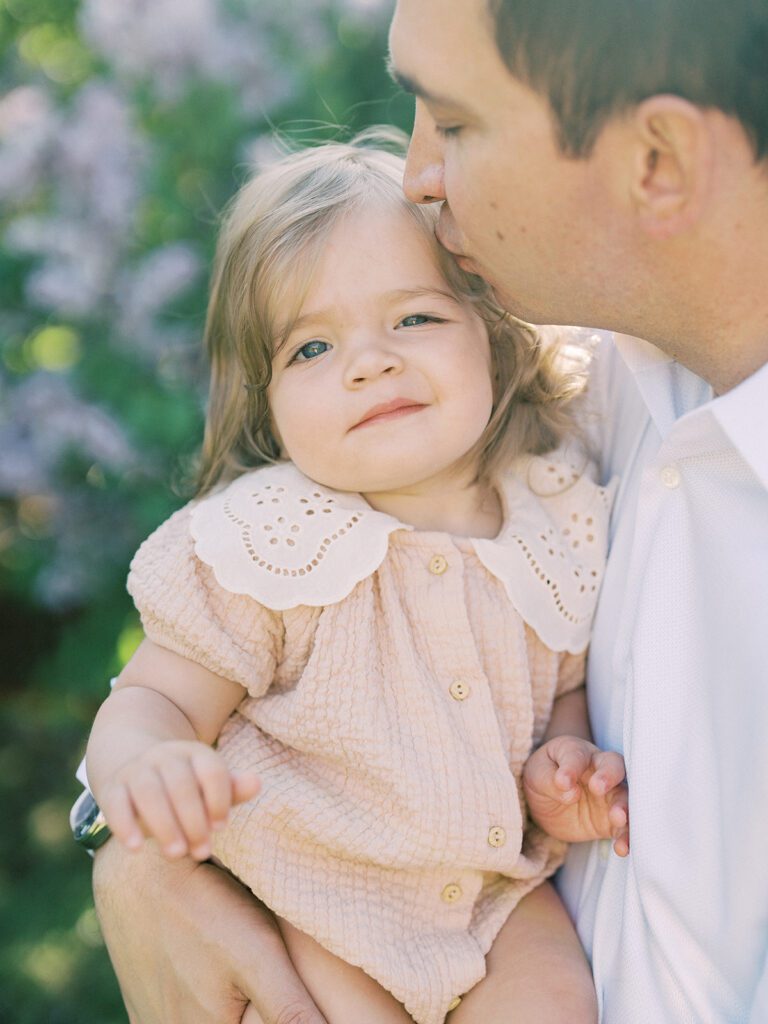 Father Kisses His Daughter's Head.