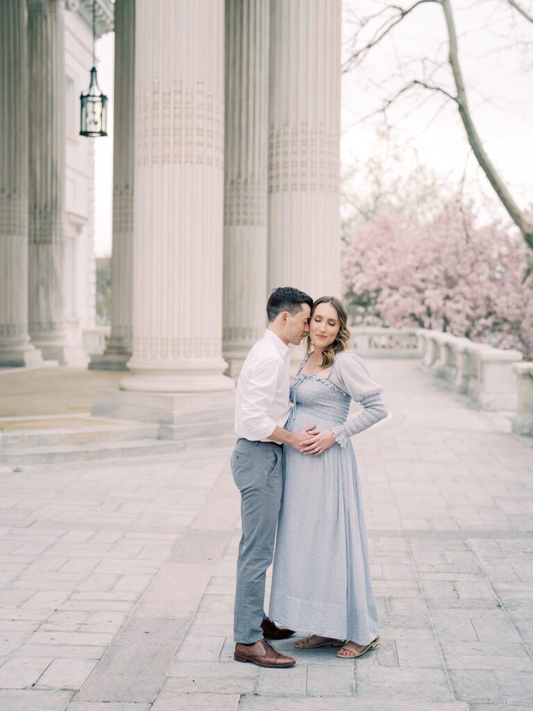 Expecting Couple Stand On The Portico Of The Dar Constitution Hall In Washington, D.c.