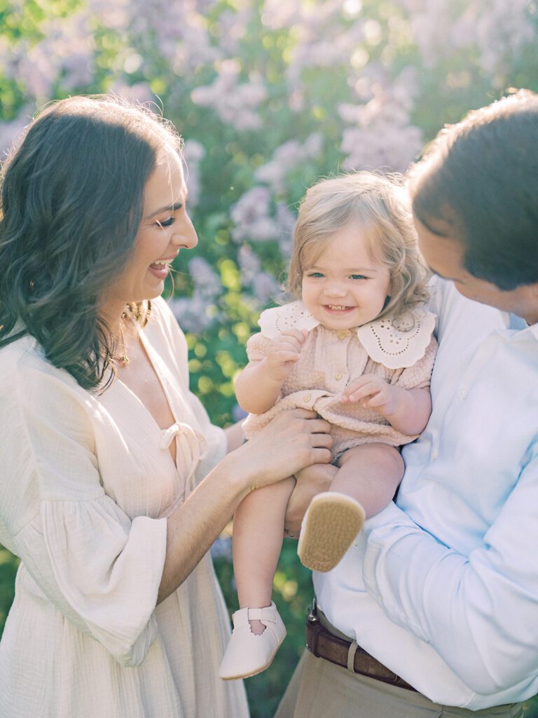 Mother And Father Tickle Their Toddler Daughter, Photographed By Bethesda Photographer Marie Elizabeth Photography.