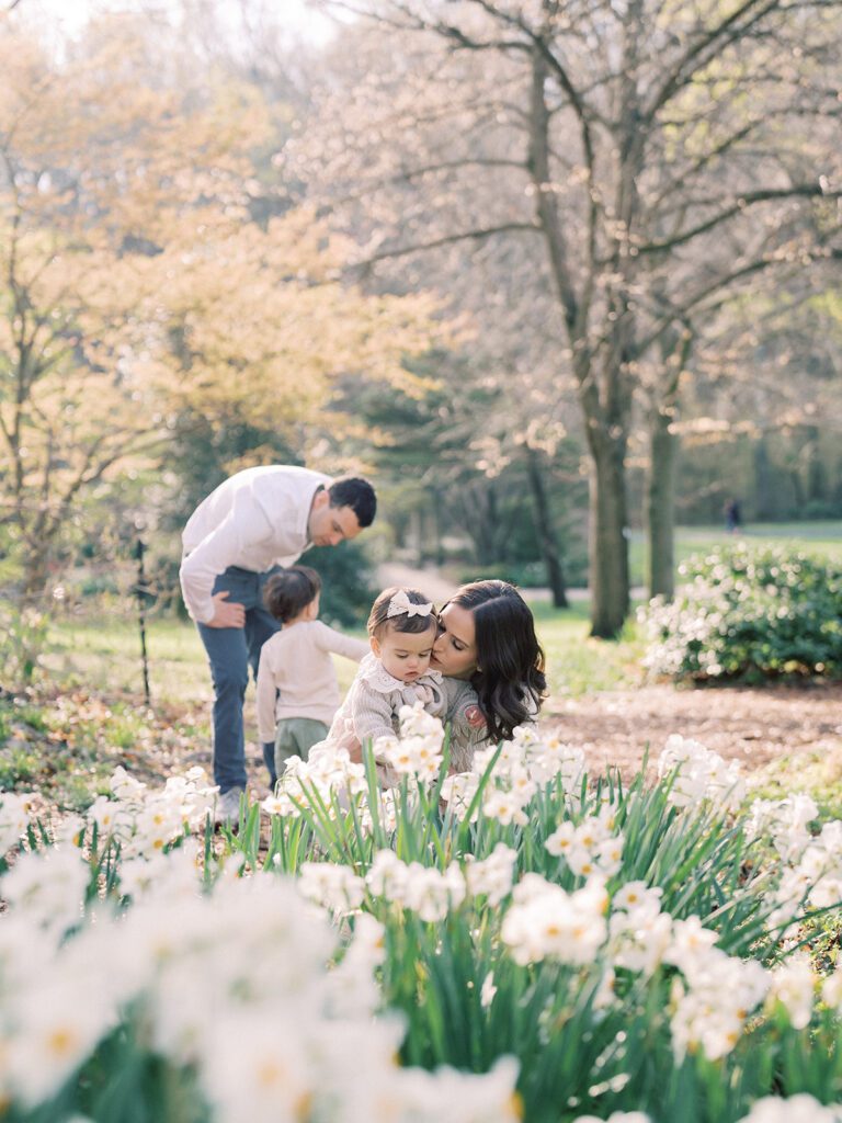 A Family Of Four Explores The Daffodils At Brookside Gardens.