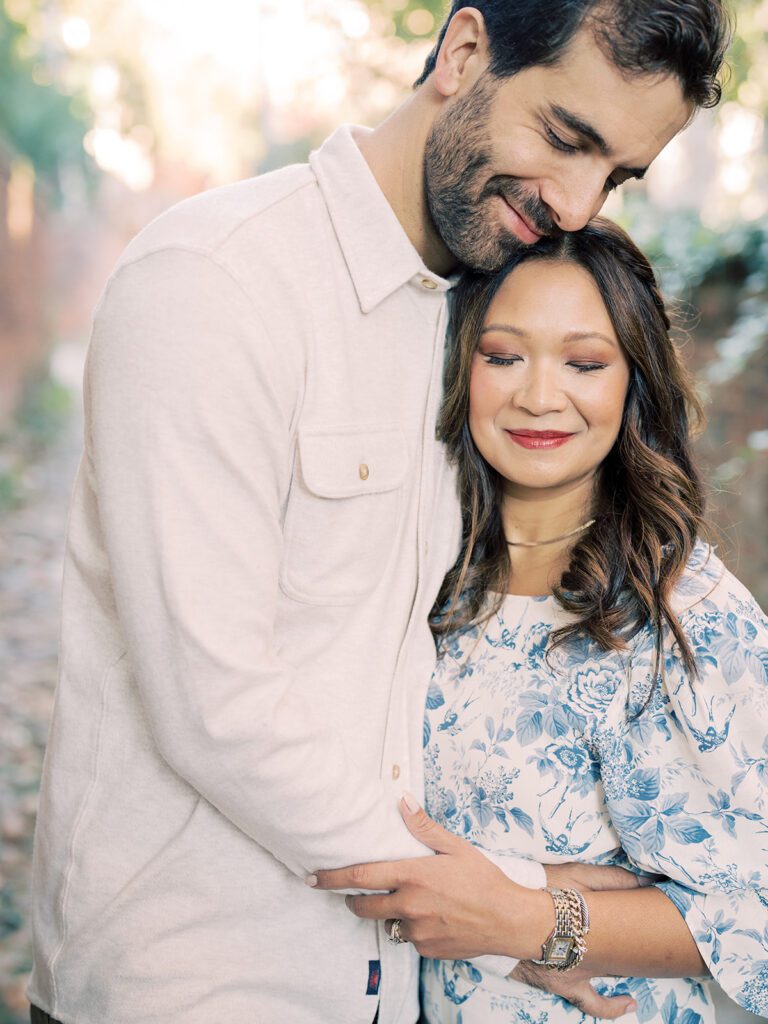 Man holds his wife as they close their eyes together, photographed by Alexandria Photographer, Marie Elizabeth Photography.