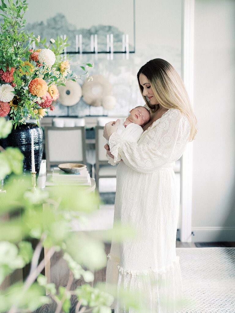 A Mother Holds Her Newborn Baby During Their Olney Newborn Photos.