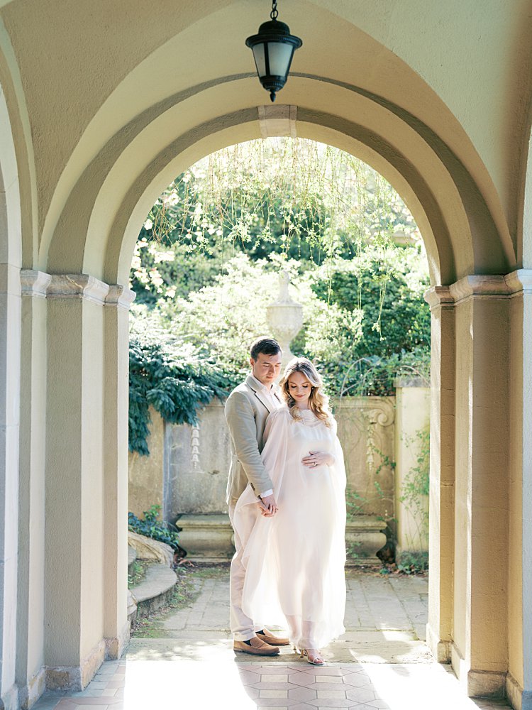A Couple Stand In An Archway At Dumbarton Oaks Gardens, Photographed By Georgetown Photographer Marie Elizabeth Photography.