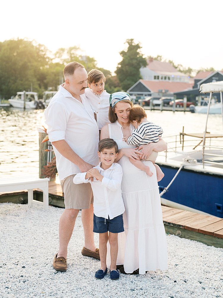 A family of five stands along a dock in St. Michael's, Maryland.